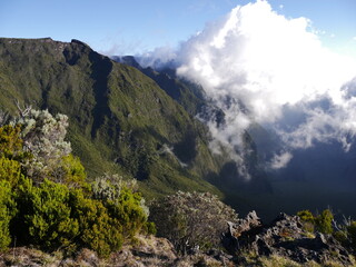 Impressive volcanic mountain  landscape with cloud in the sky in Reunion island on the way to Fournaise volcano.  Bourg Murat, Nez de Boeuf, La Réunion. 