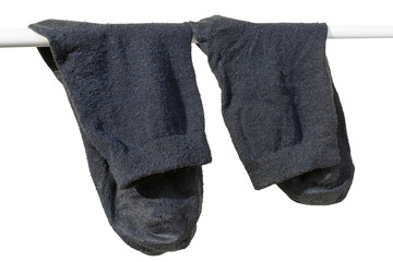 Washed men's socks are dried in the sun. Isolated on white background.
