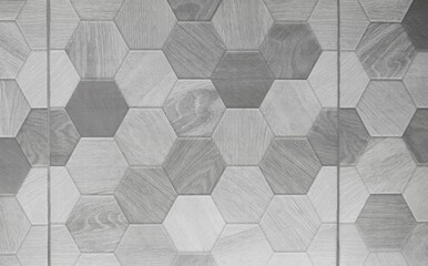 The surface of the floor tiles has a honeycomb shape.