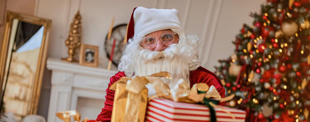 Santa Claus brought gifts to children. New year and Merry Christmas concept. Advertising banner