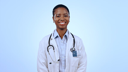 Portrait, happy woman and doctor with smile in studio for healthcare mockup on blue background in...