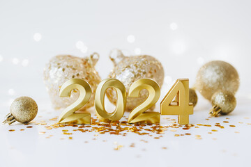 Happy new year 2024 . New year holidays card with Golden Christmas balls, glitter and garland...