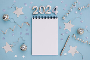 Notebook with pen and space for text for writing future plans. 2024 is coming concept