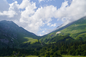 Great landscape with a green mountain pass, forests and meadows.