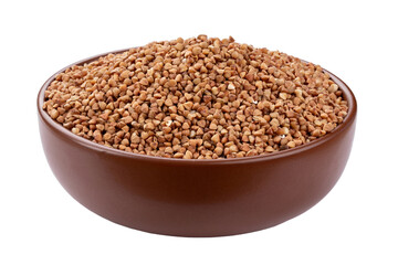 Green buckwheat grain in clay bowl isolated on white background. File contains clipping path.
