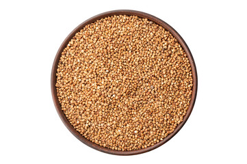 Green buckwheat grain in clay bowl isolated on white background, top view. File contains clipping path.
