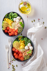 Fresh salad with groats, grains, cheese and vegetables.