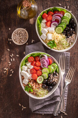 Diet Greek salad with vegetables, buckwheat groats and cheese.