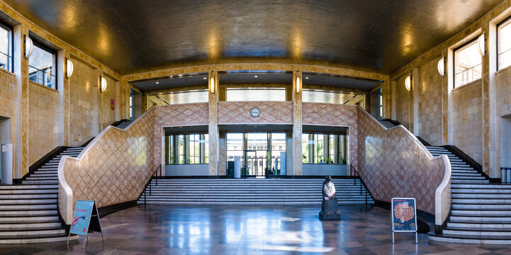 Frankfurt, Germany - Aug. 18, 2023: Lobby and double staircase of the IG Farben Building designed by Hans Poelzig in 1928, home to the Westend campus of the Goethe University Frankfurt since 2001.