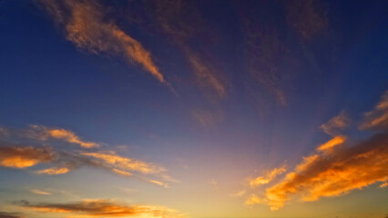 Naklejka na ściany i meble pretty sunset golden clouds on the sky bg - photo of nature