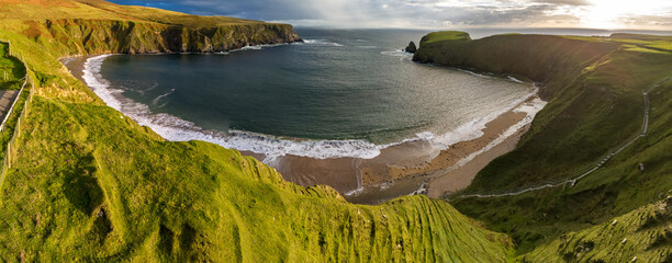 Aerial view of the beautiful coast at Malin Beg in County Donegal, Ireland - Powered by Adobe
