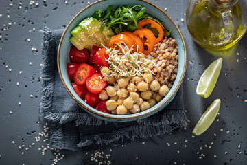 Healthy salad with chickpeas, buckwheat groats and vegetables.