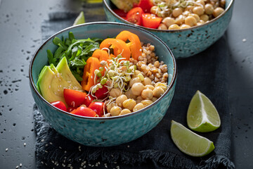 Fresh salad with groats, arugula, chickpeas and vegetables.