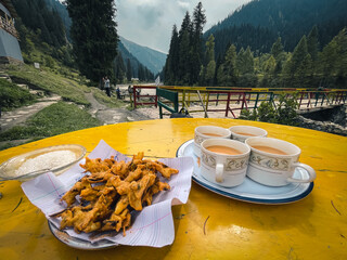 Chai and Pakora at Taobat village, Azad Kashmir, Pakistan. It is the last station in Neelam valley,...