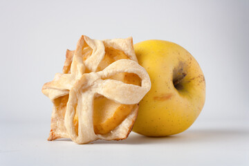 puff pastry bun with apple, on a white background, close-up