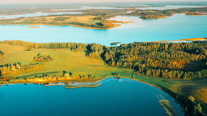 Aerial View Of Lake And Green Forest Landscape In Sunny Summer Morning. Top View Of Beautiful...