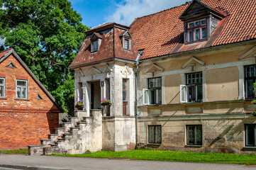 View of the street in Kuldiga with old house and stone road. Latvia. Kuldiga is included in the UNESCO World Heritage List.