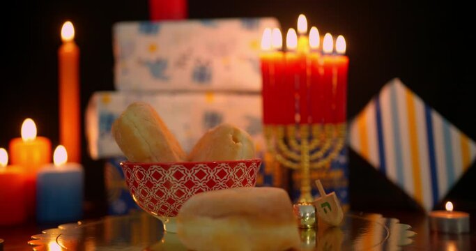 Hanukkah food and decorations in dim light