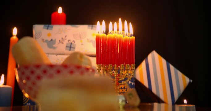 Hanukkah food and dreidels in dim light