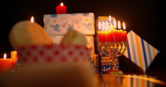 Hanukkah Table Set Decoration in the dark with Menorah and food