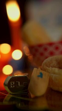 Hanukkah Table Set Decoration in the dark with Menorah and food