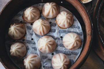 Fresh Dumplings in Traditional Round Chinese bamboo plate 