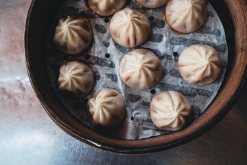 Fresh Dumplings in Traditional Round Chinese bamboo plate 