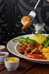 Grilled chicken thighs with vegetables and rice