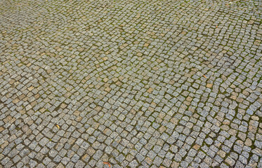 Photo of a platform made of paving stones of a square shape. Top view