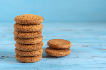  Oatmeal cookies on blue wooden background.