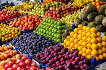Variety of fresh fruits put out on sale on the street stall