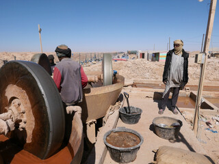 Artisanal miners in the town of Chami, Mauritania, using crushers to process gold extracted from...