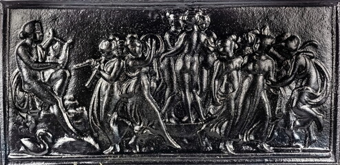 Purchased (consumer) antique rectangular bas-relief of painted cast iron close-up