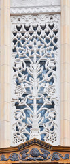 The pattern on the building. An old decoration. Architectural detail