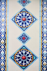 The pattern on the building. An old decoration. Architectural detail