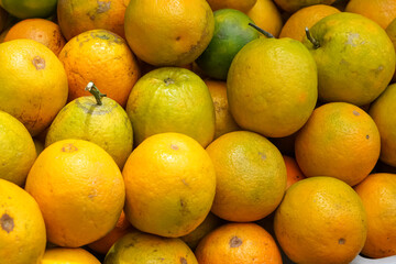 Indonesian local citrus fruit that tastes sweet and the color is a mixture of orange and green....