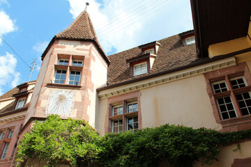 Fototapeta na wymiar sundial on the facade of a mansion (berkheim) in riquewihr in alsace in france