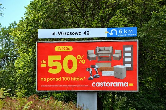 Kielce, Świętokrzyskie, Poland - 2022-06-18 - Billboard advertisement Castorama discount up to -50% ( subtitles in Polish )