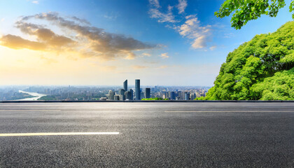 asphalt road and green tree with city skyline in hangzhou china
