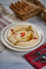 A traditional Syrian dish of hummus with oil and tahini