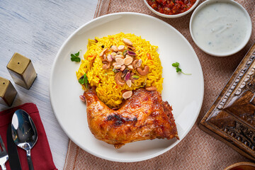 Kabsa rice dish with grilled chicken
