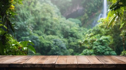 Empty table top outdoor in tropical jungle, forest greenery blurred background.