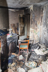 Consequences after a short circuit, burnt house interior, damaged apartment after fire, burned...
