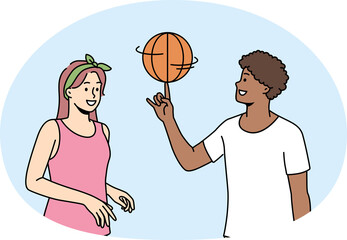 Happy multiethnic couple play basketball