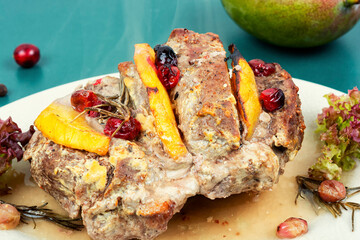 Meatloaf with mango on a plate.