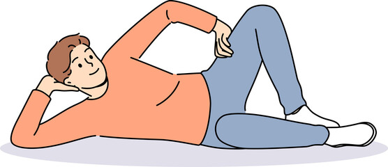 Obraz premium Man lies on floor with hand under head and with smile looks at screen, offering to relax and unwind