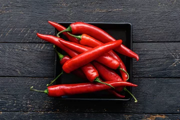 Foto op Aluminium Red hot chili pepper composition, spicy organic paprika background © RomanWhale studio