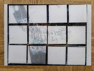 real flat bed scan of dirty black and white hand copy contact sheet with 12 empty film frames. 120mm film photo placeholder.