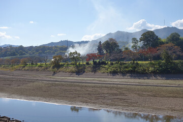 秋の篠山川と黒豆の枝を焼く煙と田園風景　JR丹波大山駅付近　丹波篠山市