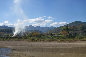 秋の篠山川と黒豆の枝を焼く煙と田園風景　JR丹波大山駅付近　丹波篠山市